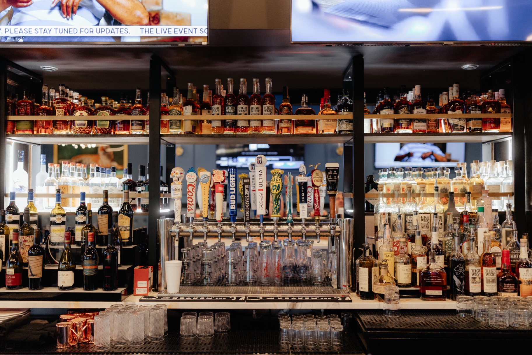 The Clubhouse bar — cold drafts and cocktails under warm lights