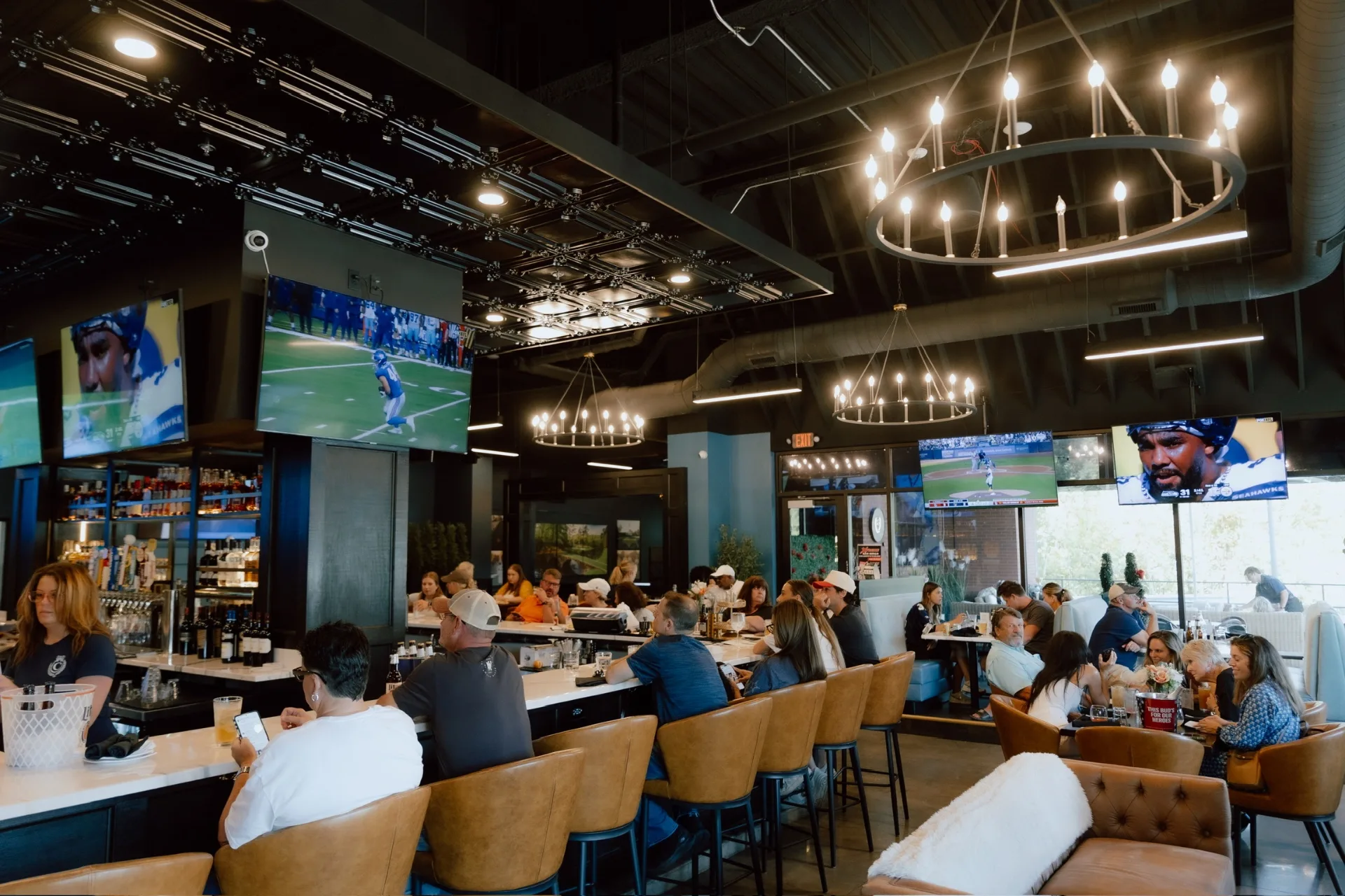 Inside The Clubhouse Bar & Grill in Edwardsville — bar seating, food, and drinks